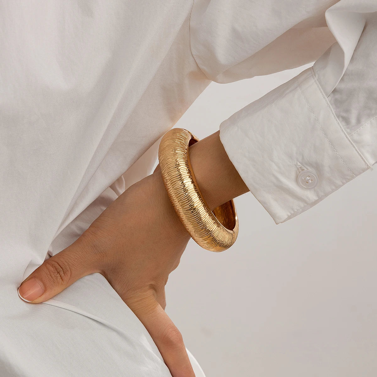 KH Wide Cuff Bangles, designed to embody confidence, elegance, and timeless luxury.